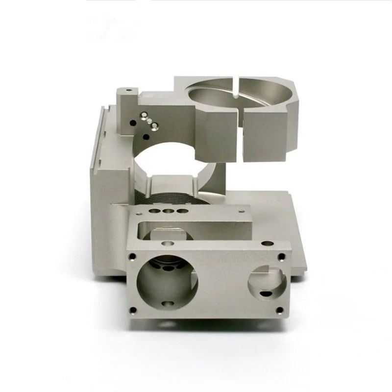A bead-blasted aluminum housing with a split clamp bore and multiple pockets